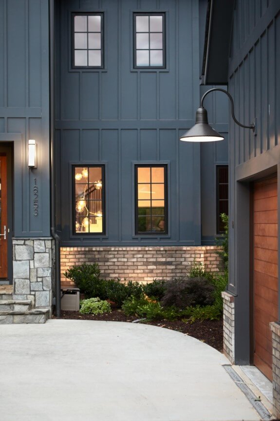 Modern house facade with windows and a wooden door