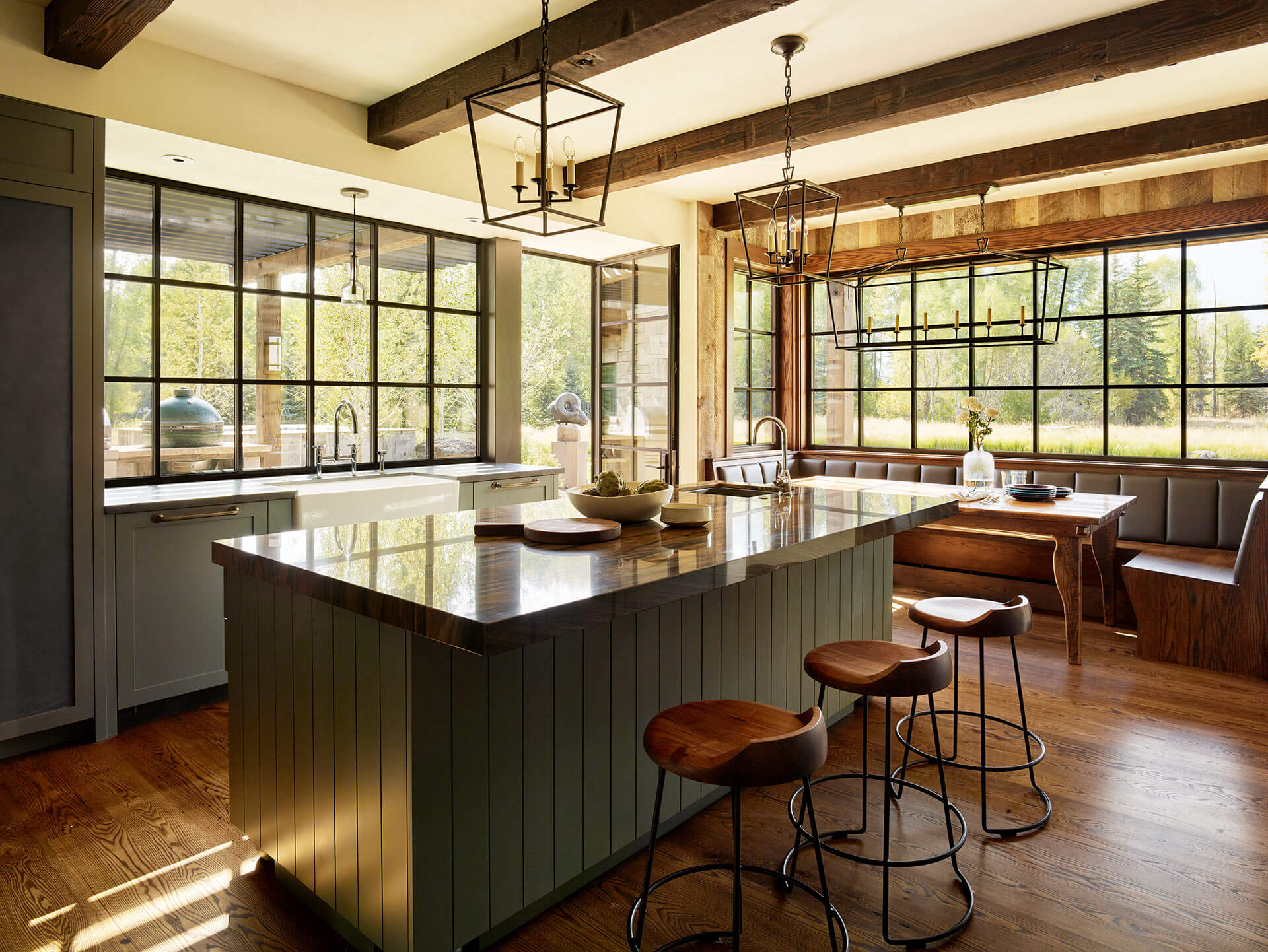 Kitchen island surrounded by large windows