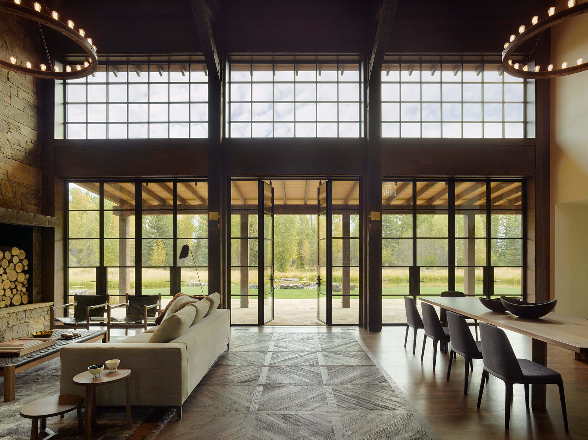 High ceiling room with tall glass doors and glass windows
