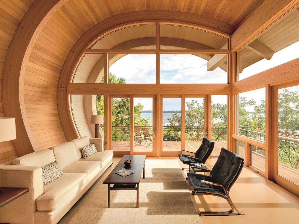 Spectacular curved room surrounded by windows doors