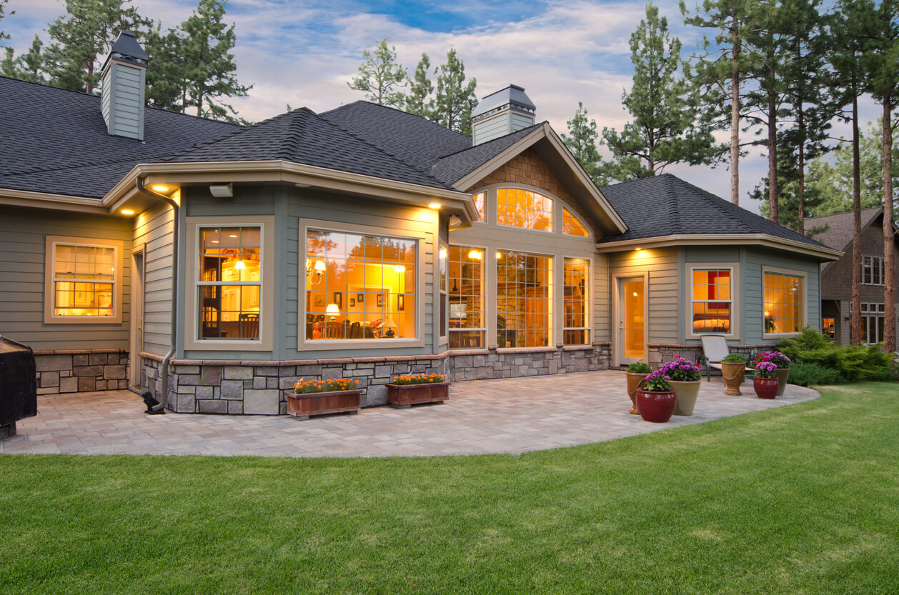 Twilight exterior of home and landscape