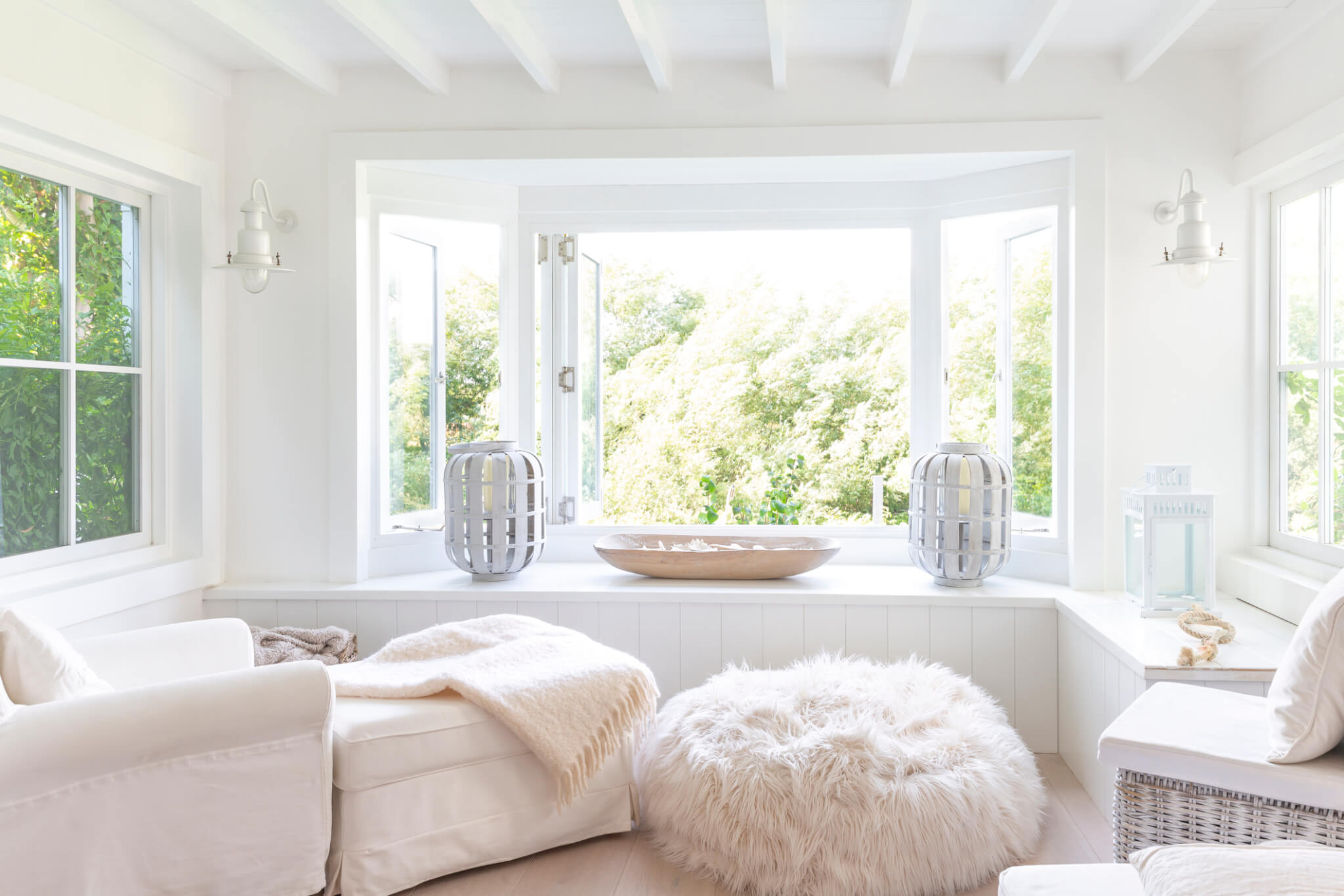 White sitting area with open windows