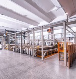 Clad wood window fabrication facility
